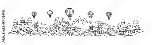 Stone village with hot air balloons floating above rocky plateau