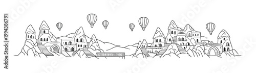 Stone houses with hot air balloons over rocky settlement
