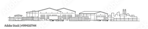 Warehouses and trucks at fenced industrial loading yard