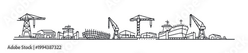 Shipyard with cranes and dry docks along industrial waterfront