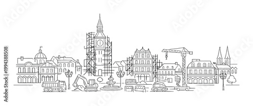 Town buildings and clock tower under renovation at construction site