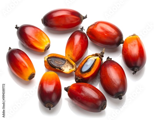 Fresh red palm oil fruits isolated.