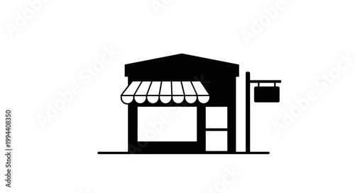 Simple storefront with awning and sign.