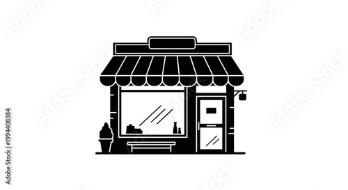 Small storefront with awning and door.
