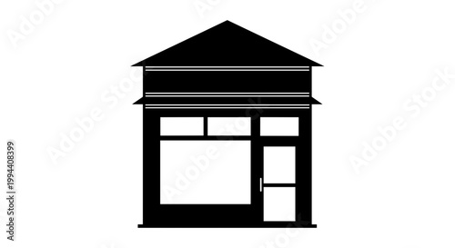 Small house with peaked roof structure.