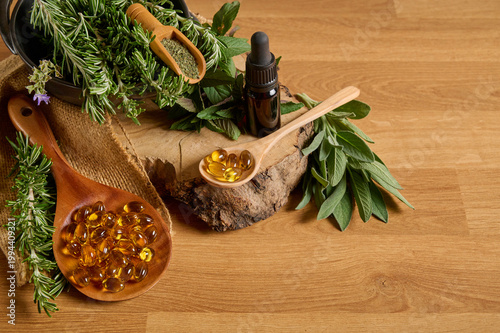 Still life with natural supplements, medicinal plants, and jars