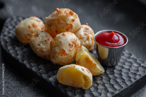 Cheese balls with sauce. Fried cheese.