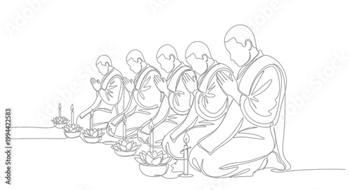 Monks sitting in a row eating.