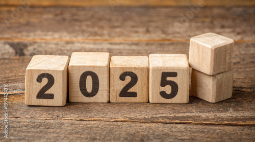 Action Plan 2025 Cube with text 2025 plans, goals, actions to list and plan for next year. Wooden cube with year 2025, plans, goals, actions, development towards success and motivation.