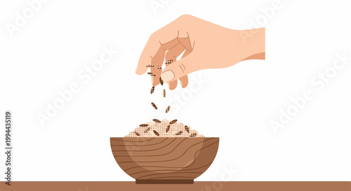 Hand sprinkling seeds into a wooden bowl filled with grain on a brown surface