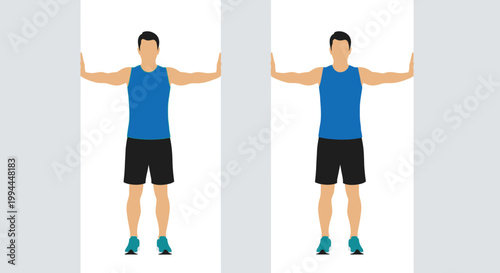 A person wearing a hijab sits at a desk using a laptop and desktop computer