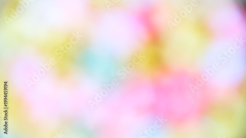 Colorful blurred lights create a vibrant background for art or design projects in a creative space during evening hours