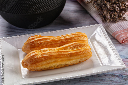 Bild auf Leinwand Sweet baked eclair dessert with cream