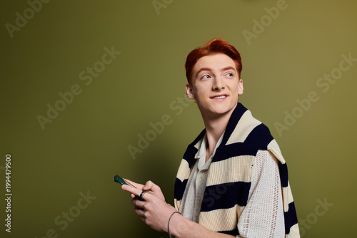 Bild auf Leinwand Charming young man with red hair enjoying a moment of blissful contemplation