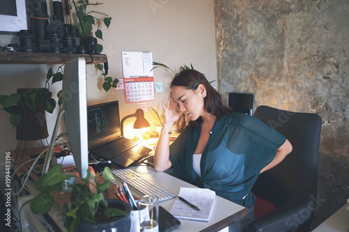 Headache, computer or woman with back pain in home office for burnout, debugging fail or remote work. Tech screen, freelance web designer and sore spine from muscle strain, stress and site test error