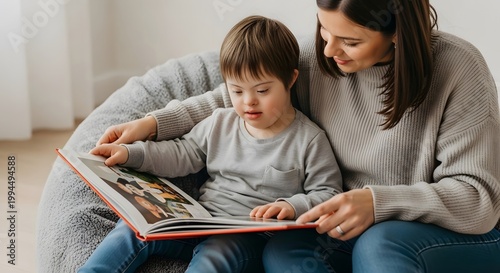 Woman reading book with a child with Down syndrome. Mother teaching son and looking at storybook together. Inclusive education, development, learning at home and family bonding concept.