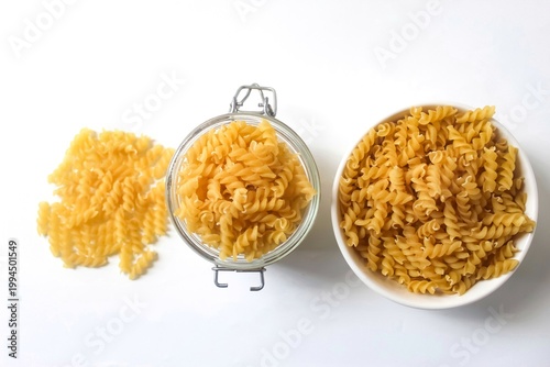 fusilli pasta in various containers isolated on white background
