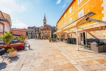 Jelsa town on Hvar island, with traditional Dalmatian stone architecture and boats moored in the harbor, Croatia.