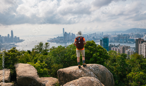 Canvas Print Woman hiking on mountain top in Hong Kong