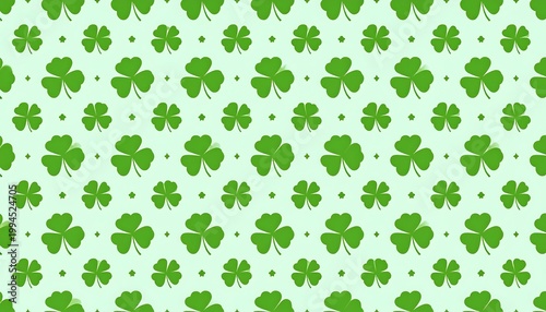 A patterned arrangement of green clover leaves on a light green background with small dots.