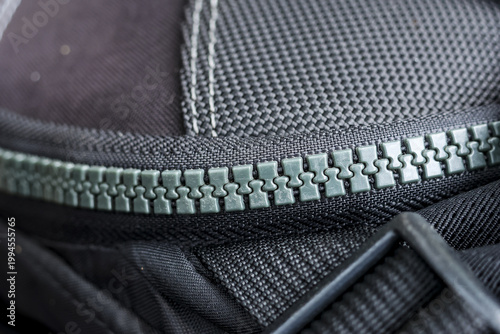 Картината върху платно Detailed close up view showing black fabric texture sturdy backpack with reliabl