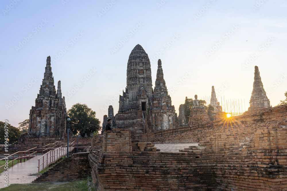 Fototapeta premium Ancient beautiful Wat Phra Si ruins bathed in peaceful serene morning sunlight showcasing historic Thai architecture old stone stupa peaceful atmosphere culture travel destionation