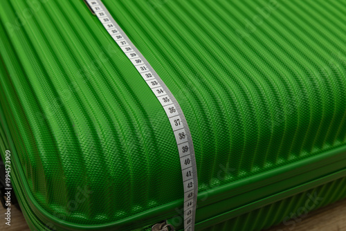 Photos Careful checking of suitcase dimensions at the airport, measuring luggage dimens