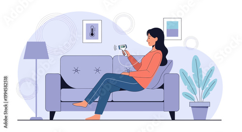 Woman relaxing on sofa using portable ultrasound device at home
