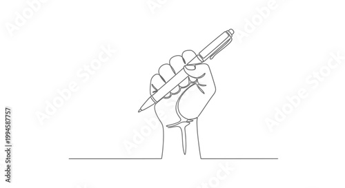Hand holding a pen writing.