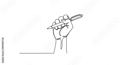 Hand holding a pen writing.