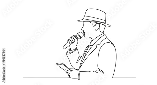 Man in hat holding microphone reading.