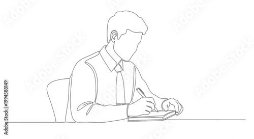 Man sitting at desk writing notes.