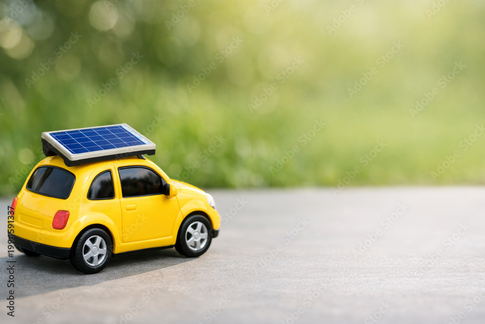 Fototapeta premium Toy car with solar panel on roof, green energy and eco-friendly electric transport concept.
