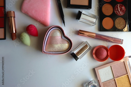 Various colorful cosmetic products on white background. Flat lay.