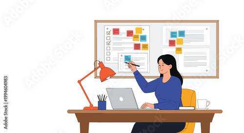 Focused woman works at her desk with a laptop while managing tasks on a large bulletin board covered in colorful sticky notes.