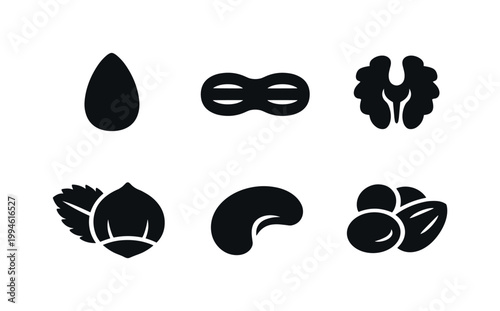 Minimal black silhouette set of natural foods including egg, bread rolls, mushrooms, fruit and nuts, arranged as simple vector icons on white background