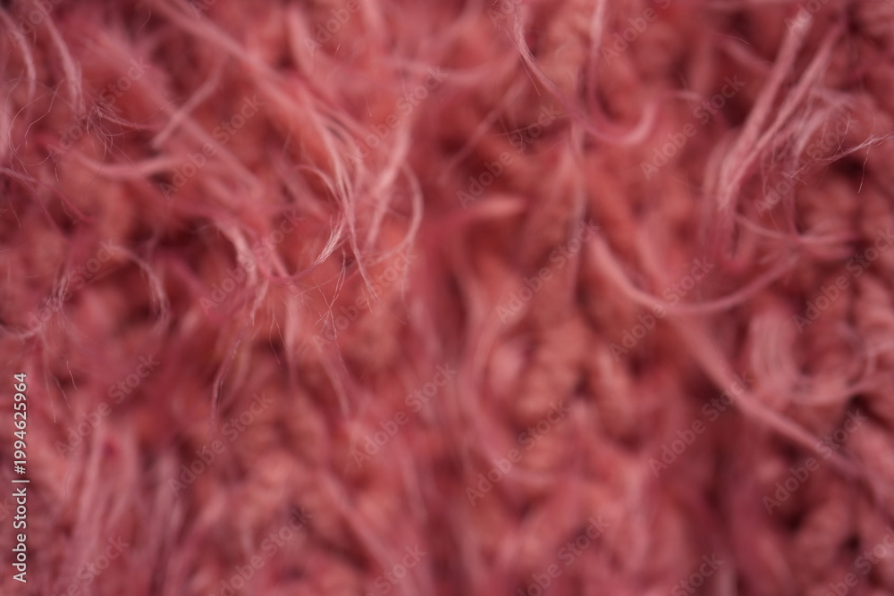 Obraz premium Pink long hair fur texture close-up, soft fluffy textile background