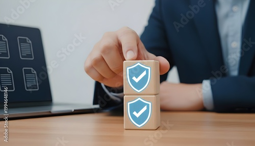 Cybersecurity specialist implementing data protection strategy with shield security icon on wooden blocks, ensuring compliance, risk management, Enterprise & Security, privacy protection and secure 