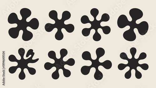 An abstract arrangement showcases eight black organic shapes resembling amoebas or stylized flowers against a pale beige background high quality professional detailed modern elegant stylish clean