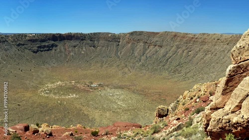 Meteor Crater, or Barringer Crater, is an impact crater about 37 mi east of Flagstaff and 18 mi west of Winslow in the desert of northern Arizona, United States