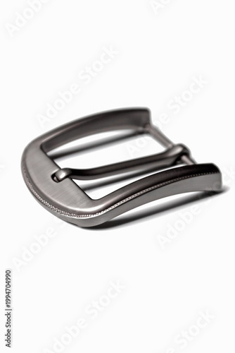 Sleek metallic belt buckle, brushed finish, isolated on white, modern men’s accessory