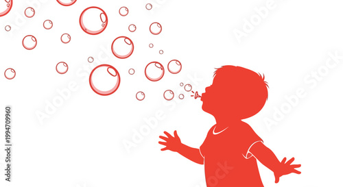 Little child blowing soap bubbles outside.