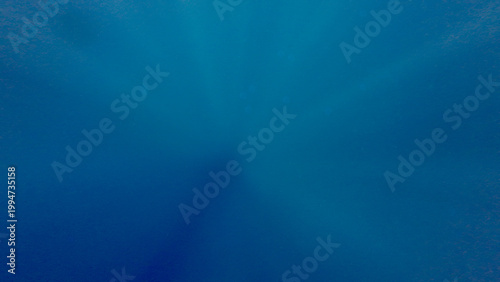 Deep blue water. Abstract blue ocean background with smooth gradient tones. Underwater texture with soft light and minimal clean composition.