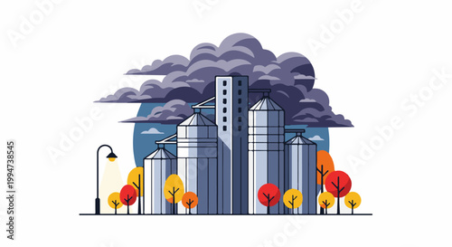 Industrial silos and autumn trees under a stormy sky with a street lamp