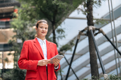 Business woman in red blaze...