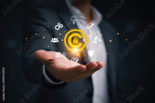 Принти на полотні Businessman holding copyright symbol represent intellectual property protection, copyright monitoring, digital rights management, legal compliance and content ownership security
