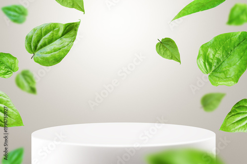 Foto Green betel leaves floating around a clean white podium