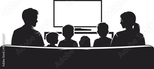 Family sitting together on a comfortable sofa watching television in their cozy home living room together