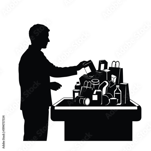 Man in silhouette putting items on a table with various objects