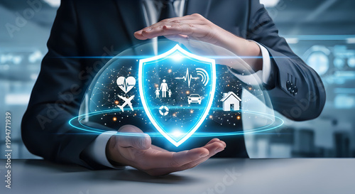 Businessman protecting a shield with family, car, and house icons inside